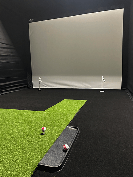 Indoor golf simulator setup of Big Moss C-Series DIY Pro Enclosure Kit with 9ft with ceiling and turf - ALLBGT