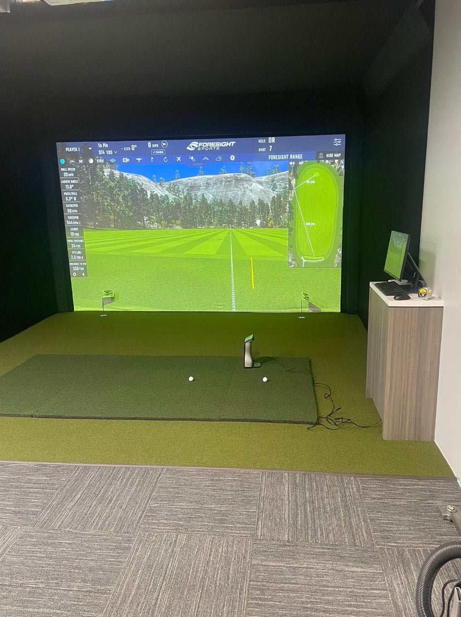 Indoor golf simulator setup featuring high-definition projection screen and turf - Big  Moss Commander bulk turf - ALLBGT