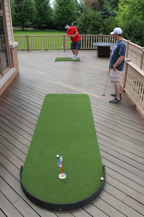 Two golfers practicing on Big Moss Commander Patio Series Putting Green 4x15 - 1 cup outdoor setup - ALLBGT