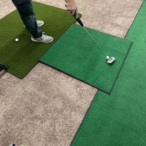 Golfer on green mat practicing with Big Moss SIM Green & Carl's Place Complete C Series Pro Golf Enclosure Kit - ALLBGT