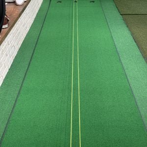 Top view of Big Moss Michael Breed's "Let's Do This!" 2.0 Putting green with yellow alignment lines and turf surface - ALLBGT