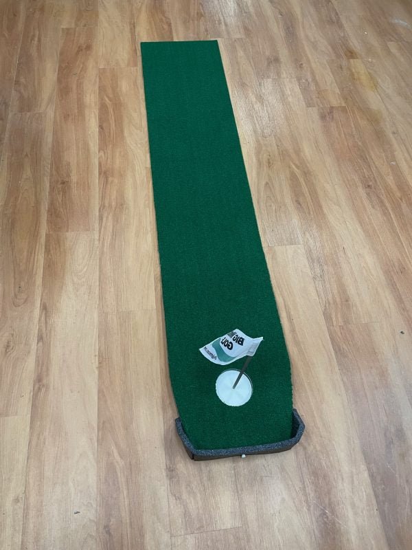 "Top-down view of the Big Moss Office Putting Green 6-foot mat with realistic turf and cup target - ALLBGT"