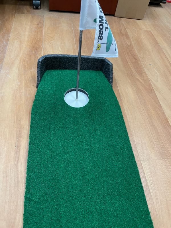 "Close-up of the Big Moss Office Putting Green 6-foot mat showing putting hole and smooth roll surface - ALLBGT"