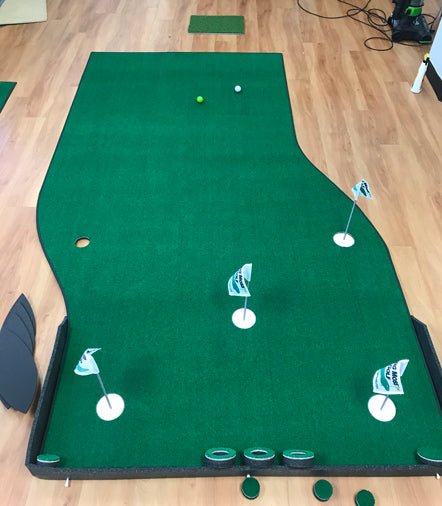Indoor setup of Big Moss The Natural Putting Green showing multiple holes and chipping area - ALLBGT
