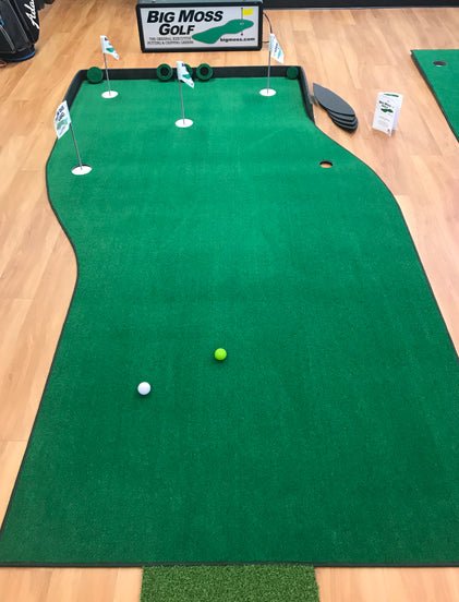 Top view of Big Moss The Natural Putting Green with golf balls and flag cups on hardwood floor - ALLBGT