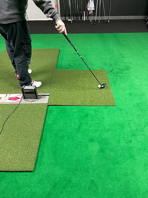 "Golfer during swing using the Big Moss TL Ball Return Ramp 3x3 Putting Green Accessory - ALLBGT"