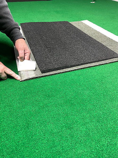 "Person setting up the Big Moss TL Ball Return Ramp - 3x3 Putting Green Accessory - ALLBGT"