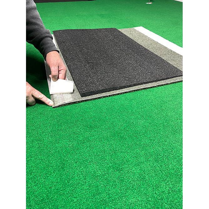 "Person setting up the Big Moss TL Ball Return Ramp - 3x3 Putting Green Accessory - ALLBGT"