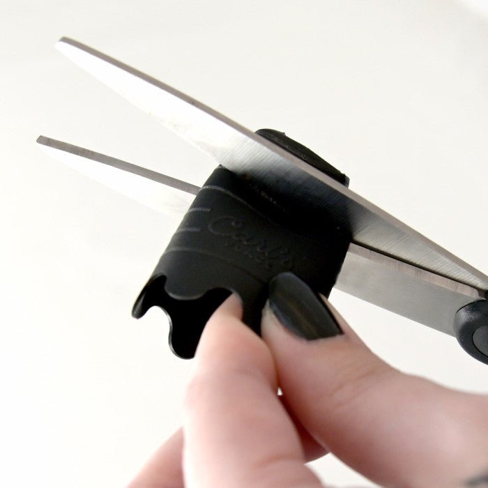 Scissors cutting Carl’s Place HotShot Indoor Golf Tee to custom height for training use. - ALLBGT