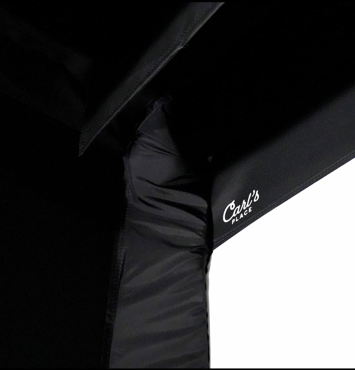 "Close-up of Carl’s Place Pro Golf Simulator Enclosure Kit showing durable frame and impact screen fabric - ALLBGT."