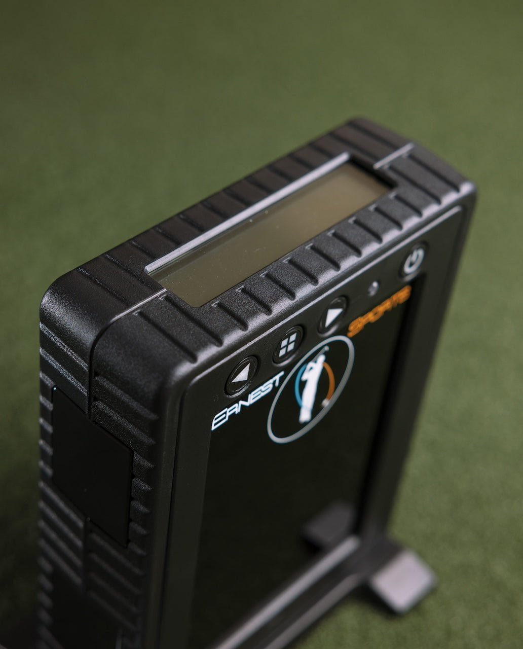 Side view of Ernest Sports ES Tour Plus Launch Monitor 2.0 standing on turf with control panel - ALLBGT