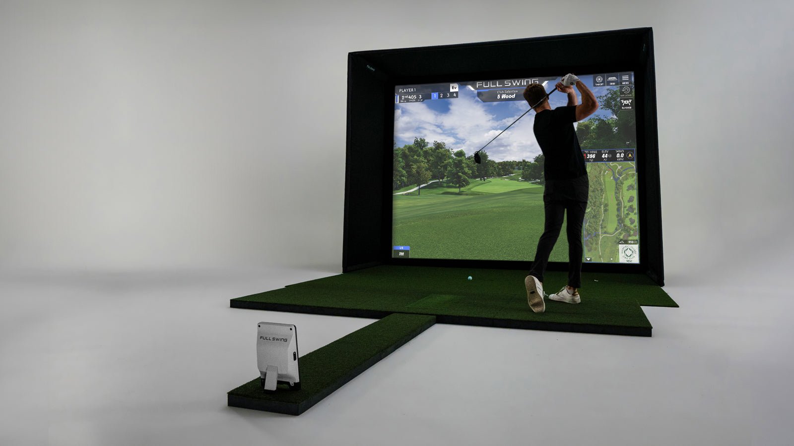 Angled view of golfer using the Full Swing KIT Studio 12’ Screen Package - ALLBGT