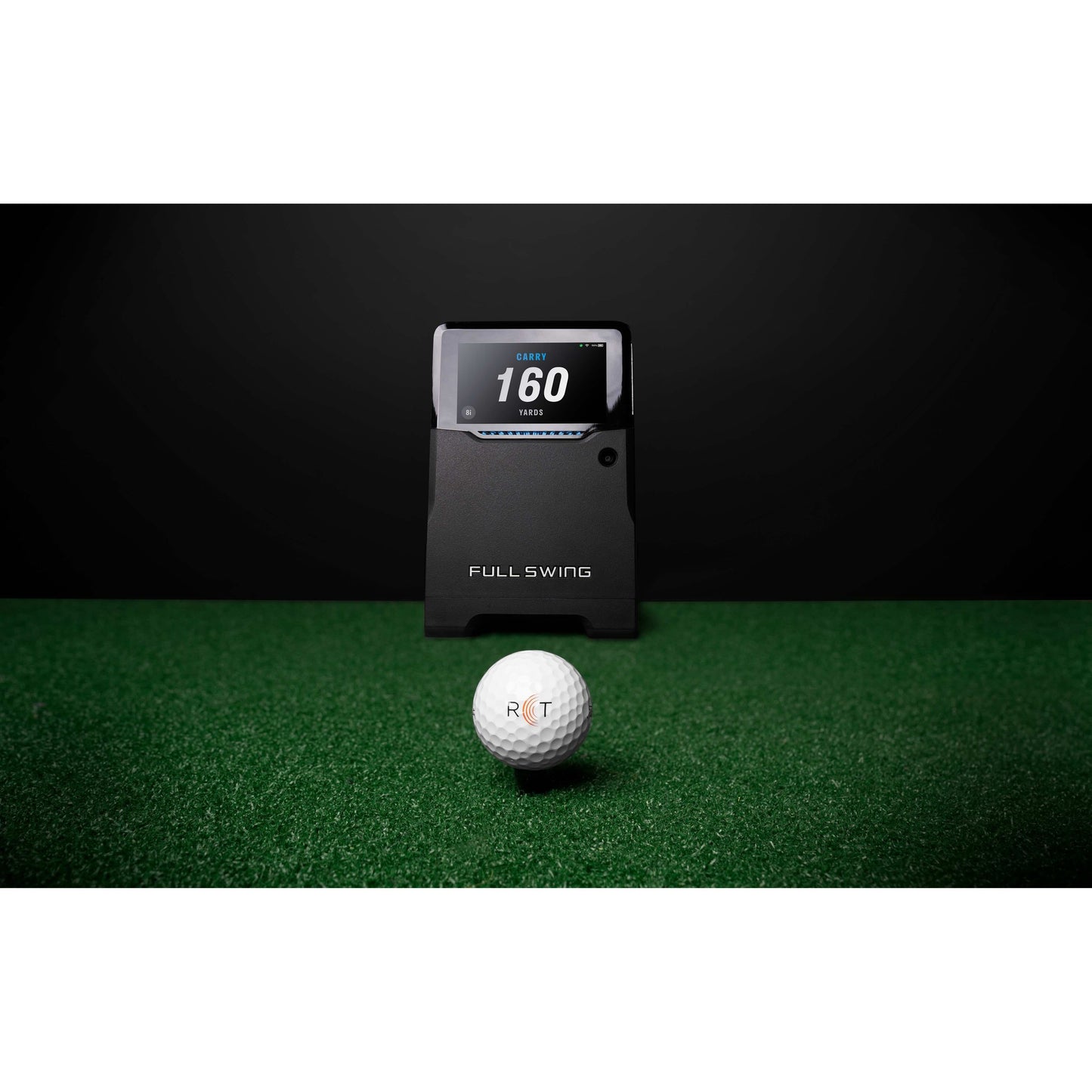 “Full Swing KIT Golf Launch Monitor with a golf ball in front it on turf - ALLBGT.”