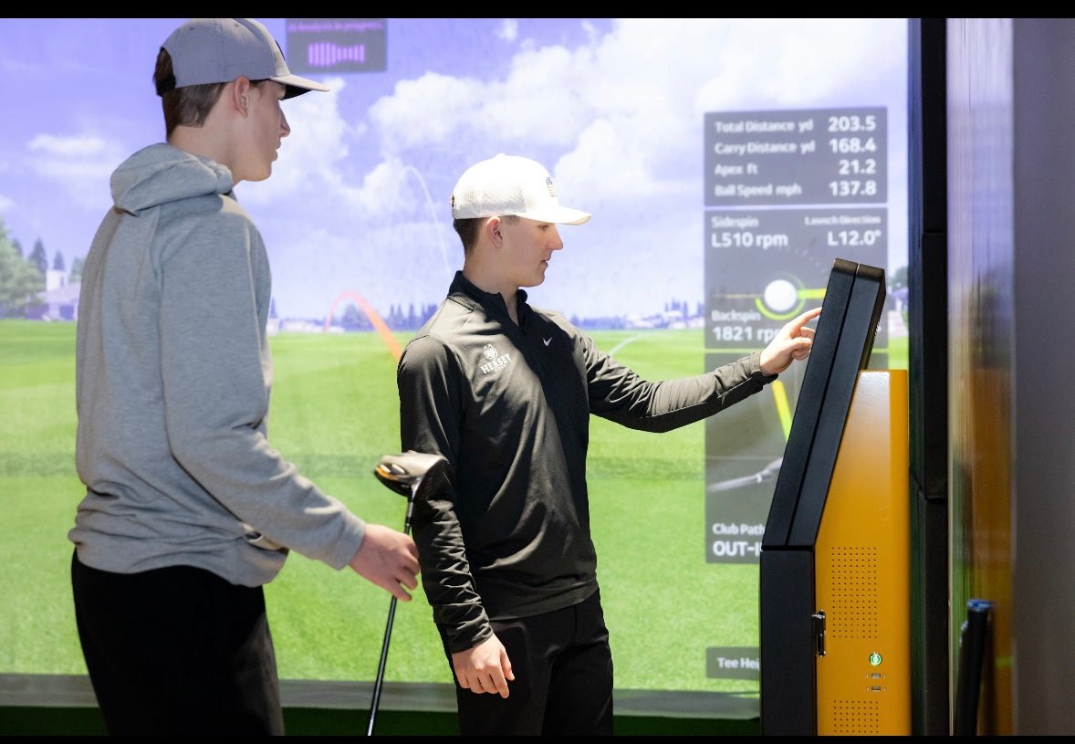 Two golfers using the Golf VX T2 Simulator at indoor golf facility - ALLBGT