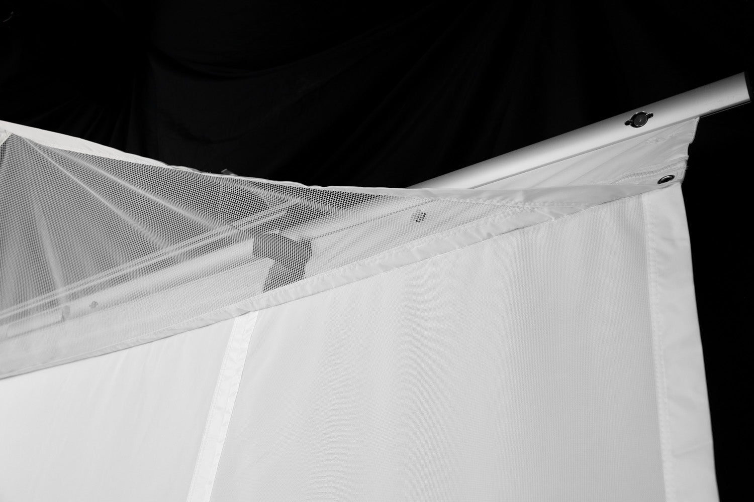 Corner view of the HomeCourse ProScreen Retractable simulator screen - ALLBGT