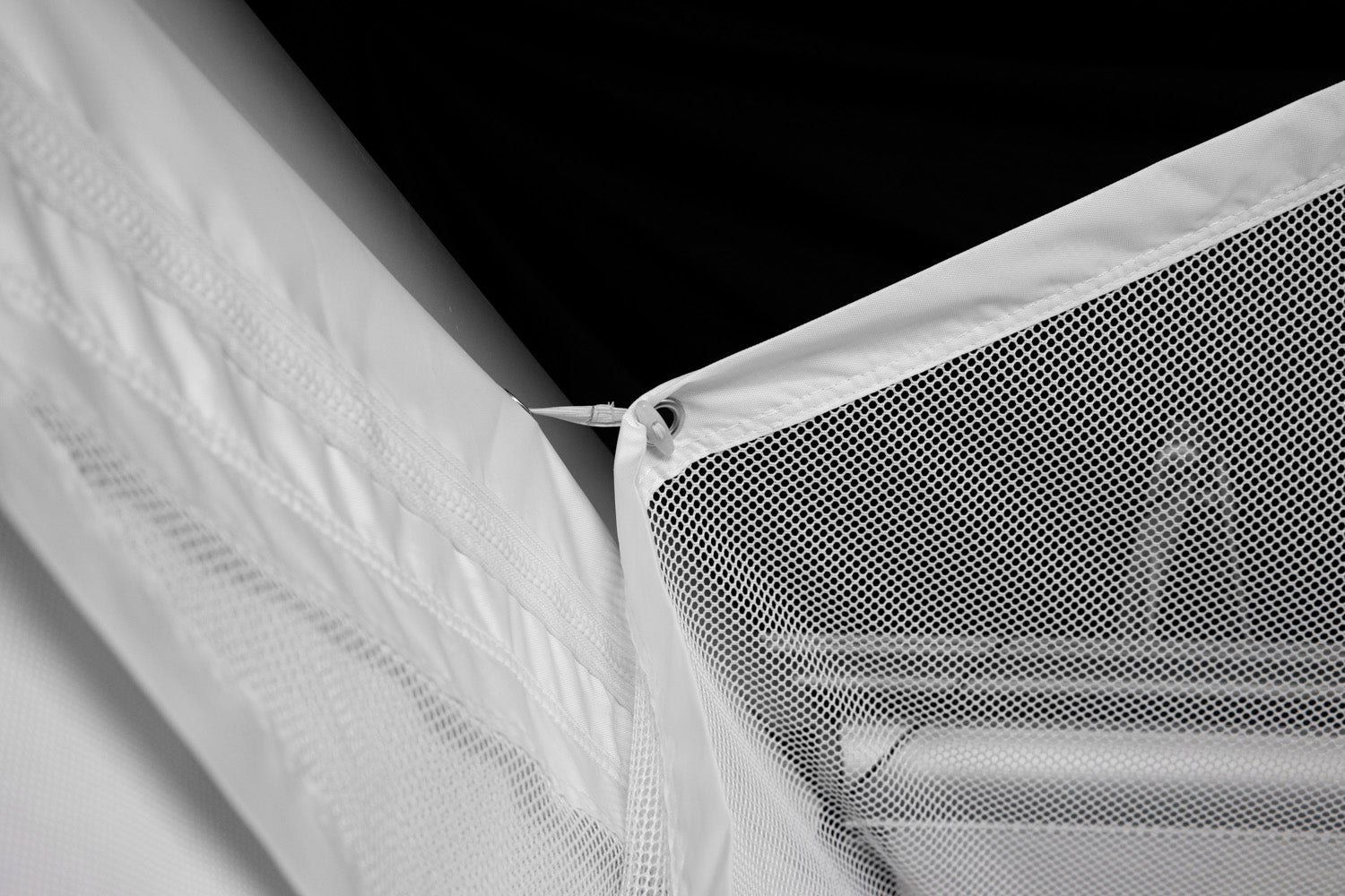 Angled view of the HomeCourse ProScreen Retractable simulator screen - ALLBGT