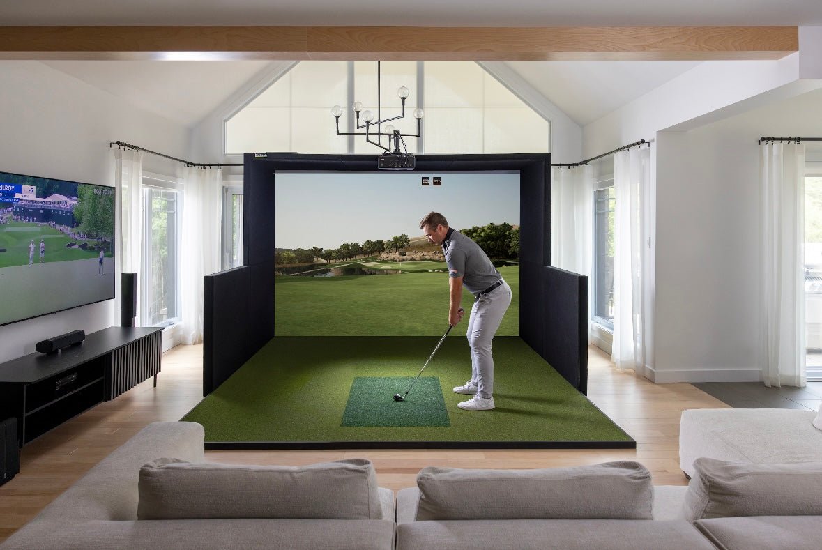 Golfer putting on green mat inside SimBooth Kit 1 indoor golf simulator with full screen projection - ALLBGT