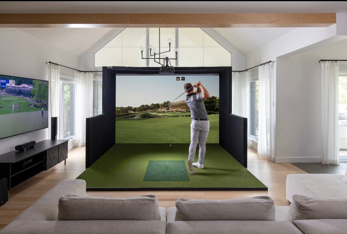 Golfer swinging inside SimBooth 1 indoor golf simulator bay with HD impact screen and turf hitting mat - ALLBGT