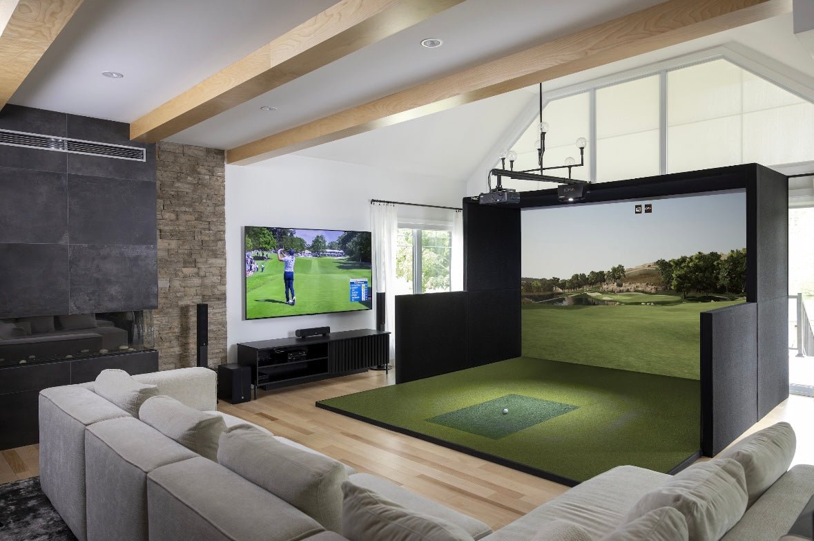 SimBooth Kit 1 home golf simulator setup in modern living room with HD screen and hitting mat - ALLBGT