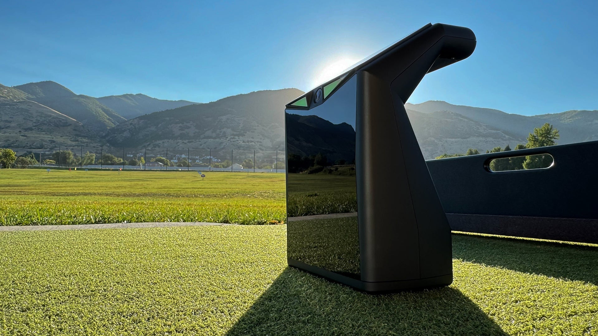 "Close-up of the TruGolf LaunchBox Launch Monitor showing compact design and front sensor panel - ALLBGT"