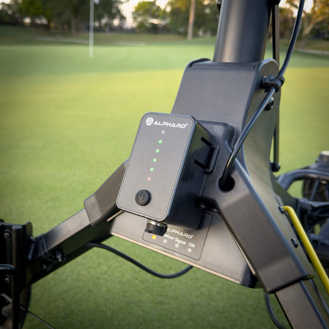 Close-up of Cybercart sidekick auto follow electric golf caddy with  'Alphard' branding on it. 