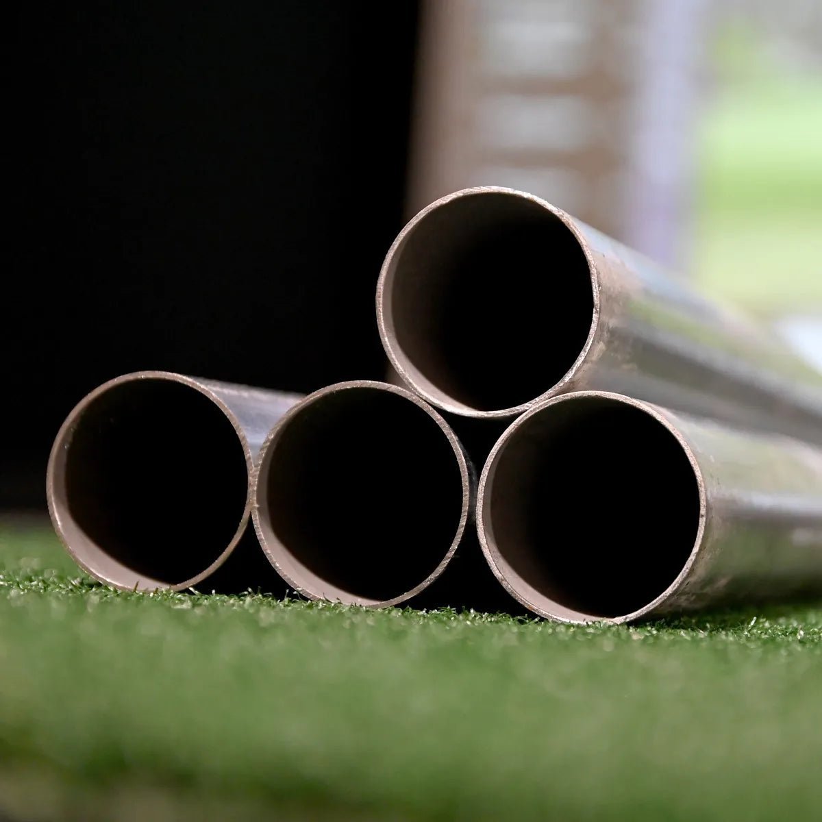 Close-up of bundled EMT pipe ends included in Carl's Place Pro Golf Simulator Enclosure Golf Pipe Framing Kit - ALLBGT