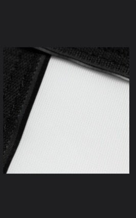 SIG DIY Golf Simulator impact screen fabric close-up showing durable white screen and black trim edge - ALLBGT