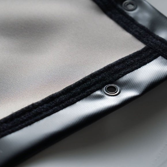Close-up SIGPRO Premier gray impact screen metallic surface with a button detail - ALLBGT