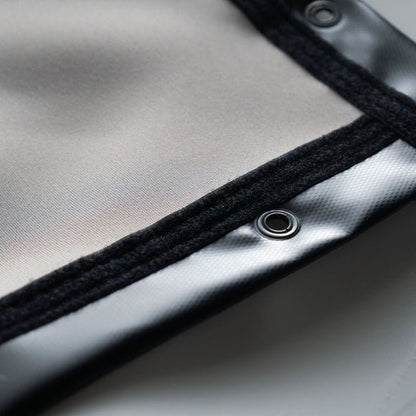 Close-up SIGPRO Premier gray impact screen metallic surface with a button detail - ALLBGT