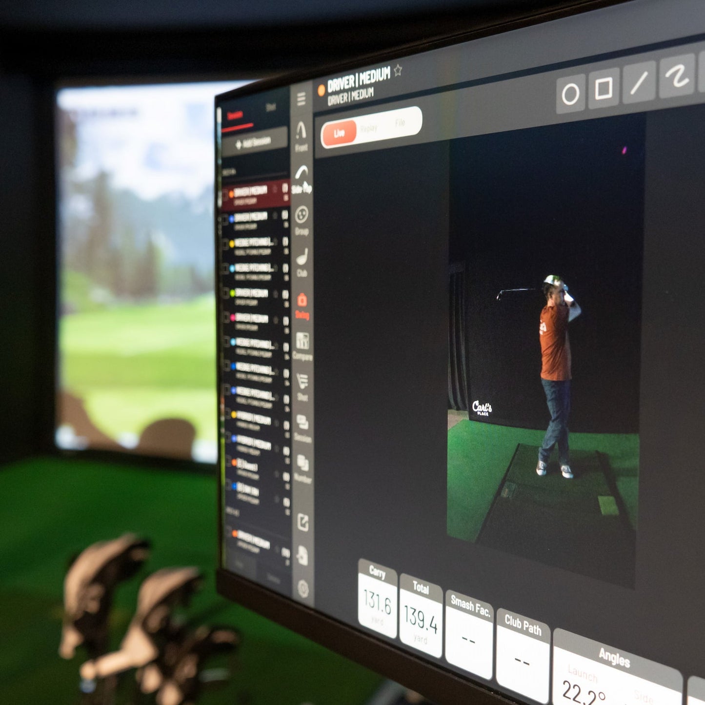 Uneekor EYE XO2 golf simulator software showing real-time ball and club data analytics inside Carl's Place indoor simulator.